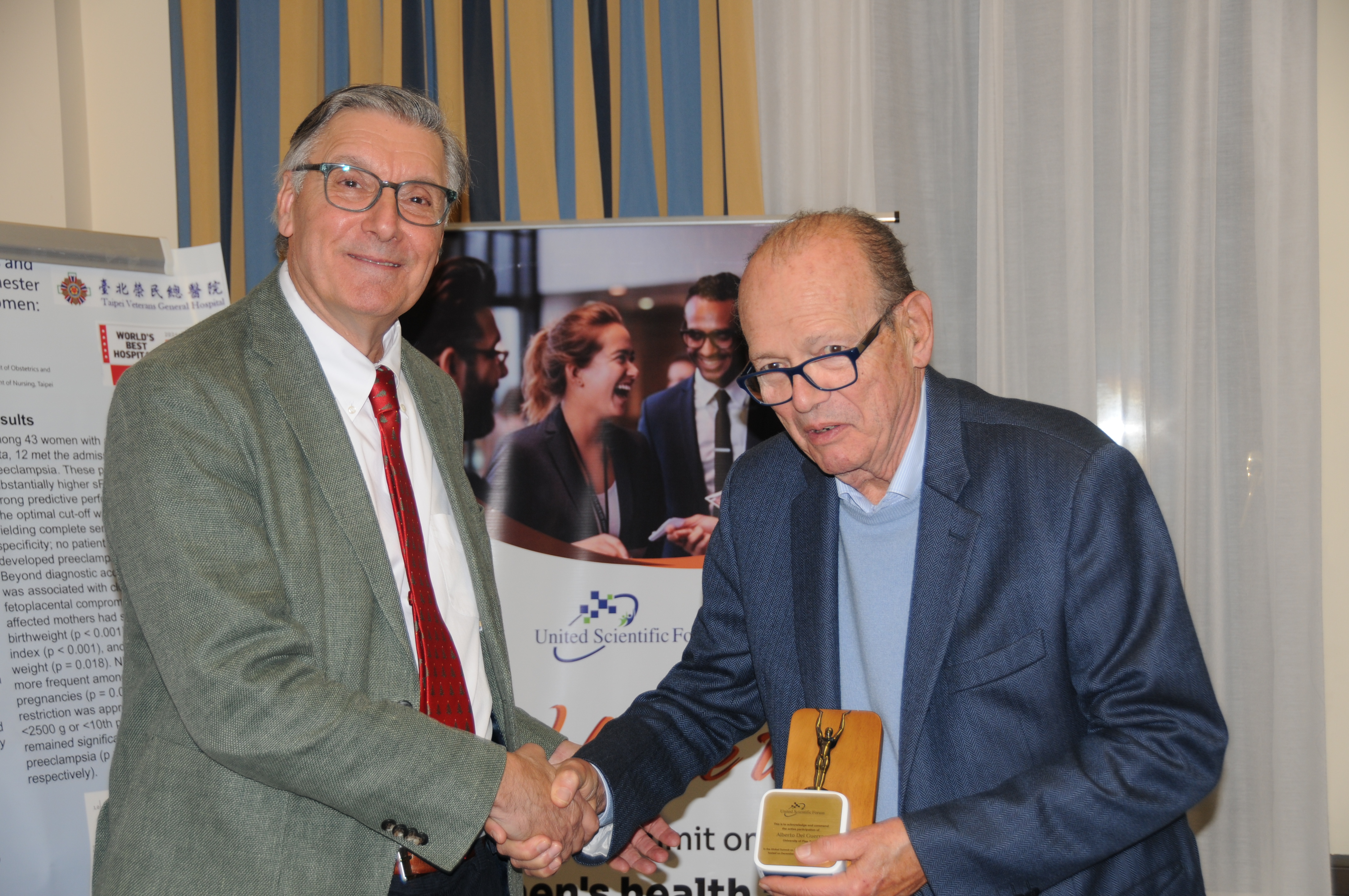 Conference organizer presenting a scientific excellence award to a distinguished researcher during the international healthcare conference.