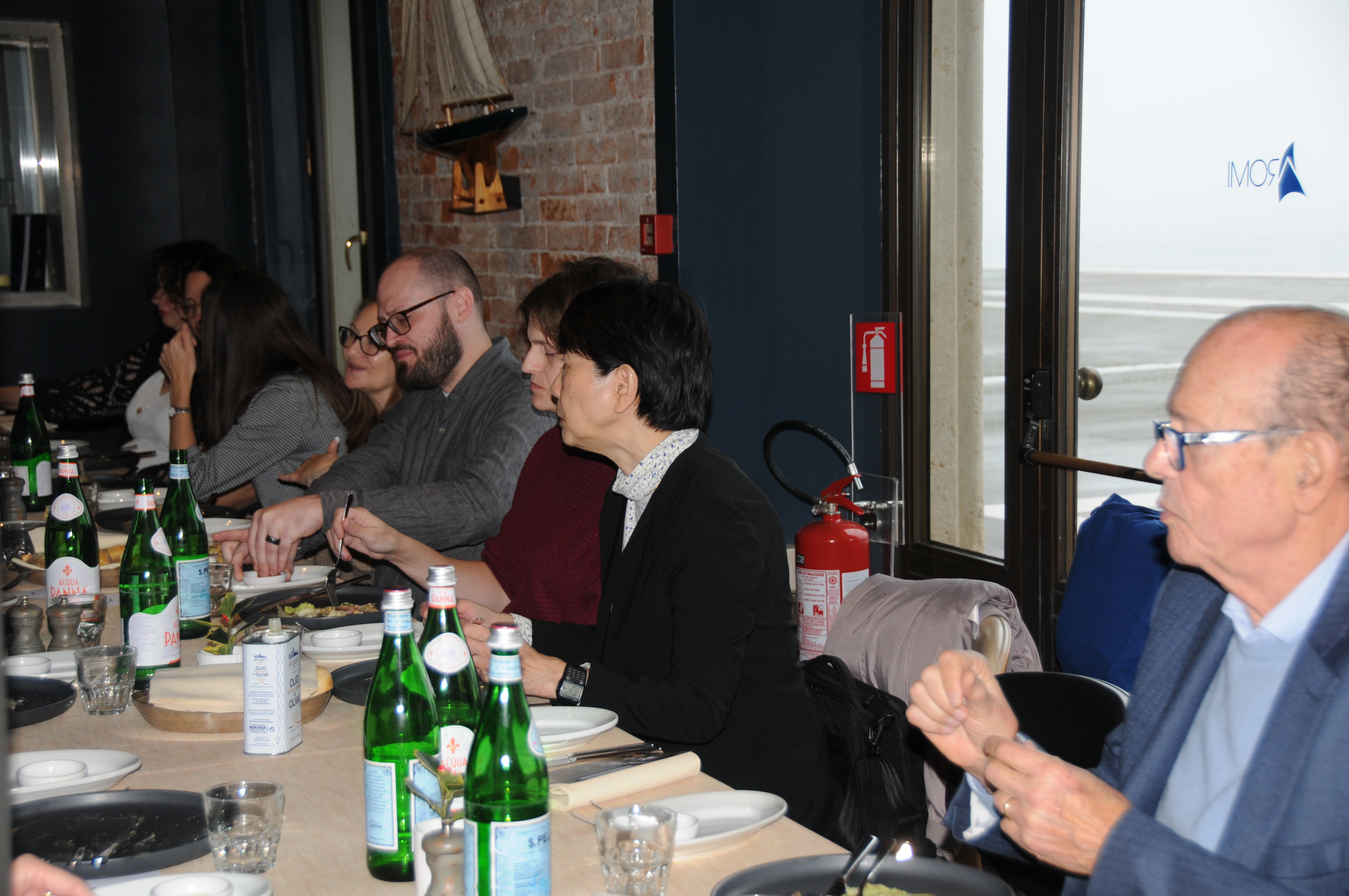 International conference delegates enjoying a networking dinner, exchanging ideas and building professional collaborations during the scientific meeting.
